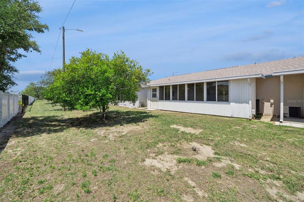 283 Winter Ridge Boulevard, Unit 283 Winter Haven, FL 33881 - Photo 17 of 20 front view of a house with a yard