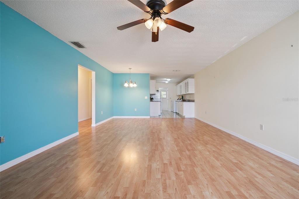 283 Winter Ridge Boulevard, Unit 283 Winter Haven, FL 33881 - Photo 2 of 20 a view of empty room with wooden floor