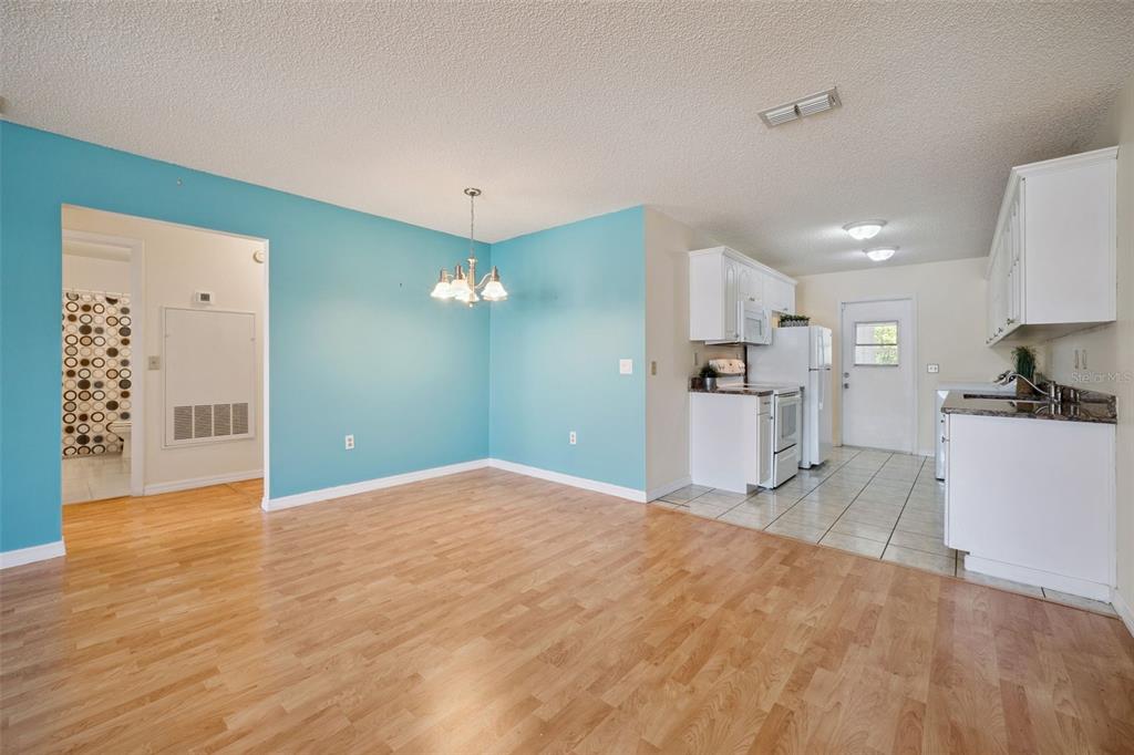283 Winter Ridge Boulevard, Unit 283 Winter Haven, FL 33881 - Photo 3 of 20 a view of a kitchen with a sink and cabinets