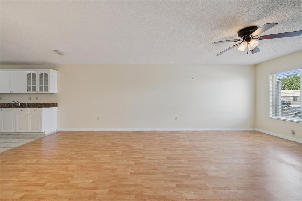 283 Winter Ridge Boulevard, Unit 283 Winter Haven, FL 33881 - Photo 4 of 20 a view of an empty room with a window