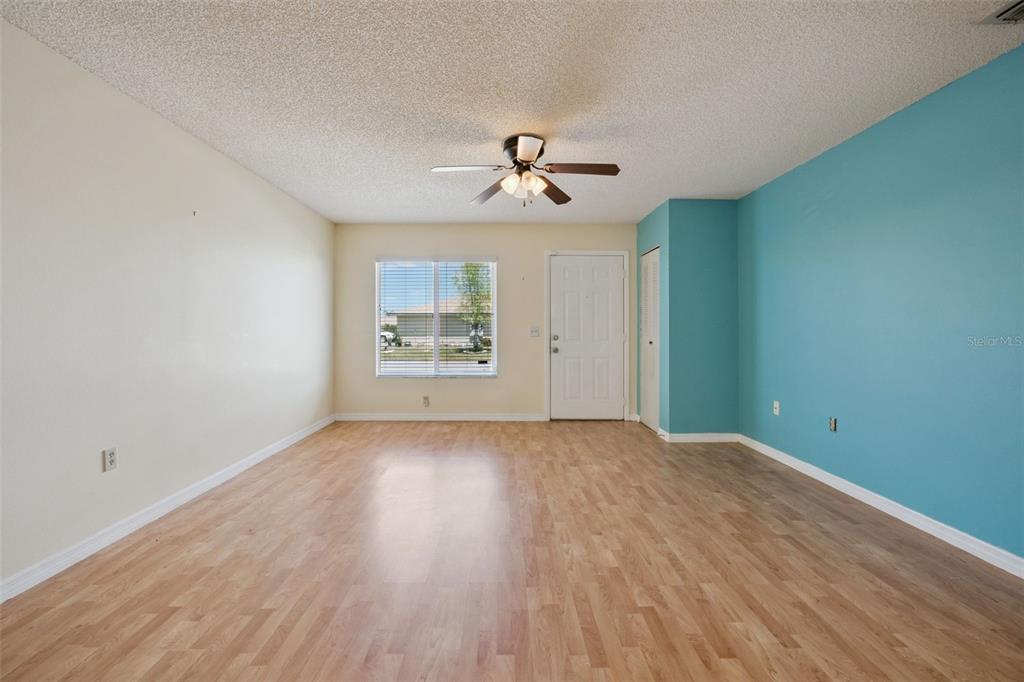 283 Winter Ridge Boulevard, Unit 283 Winter Haven, FL 33881 - Photo 5 of 20 wooden floor in an empty room with a window