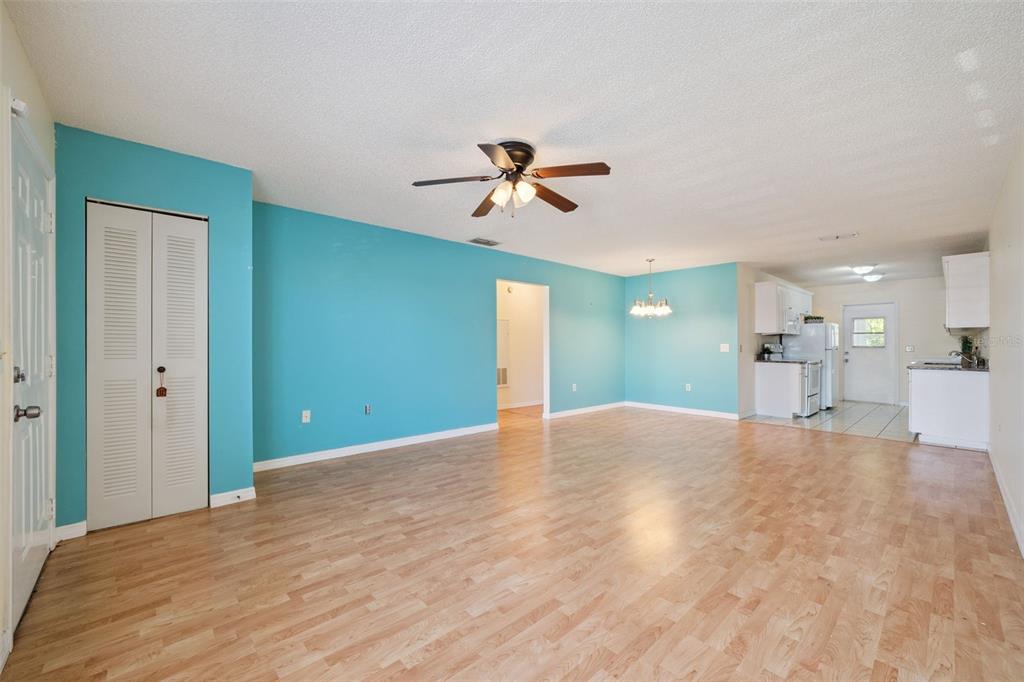 283 Winter Ridge Boulevard, Unit 283 Winter Haven, FL 33881 - Photo 6 of 20 a view of a kitchen with a sink and a chandelier fan