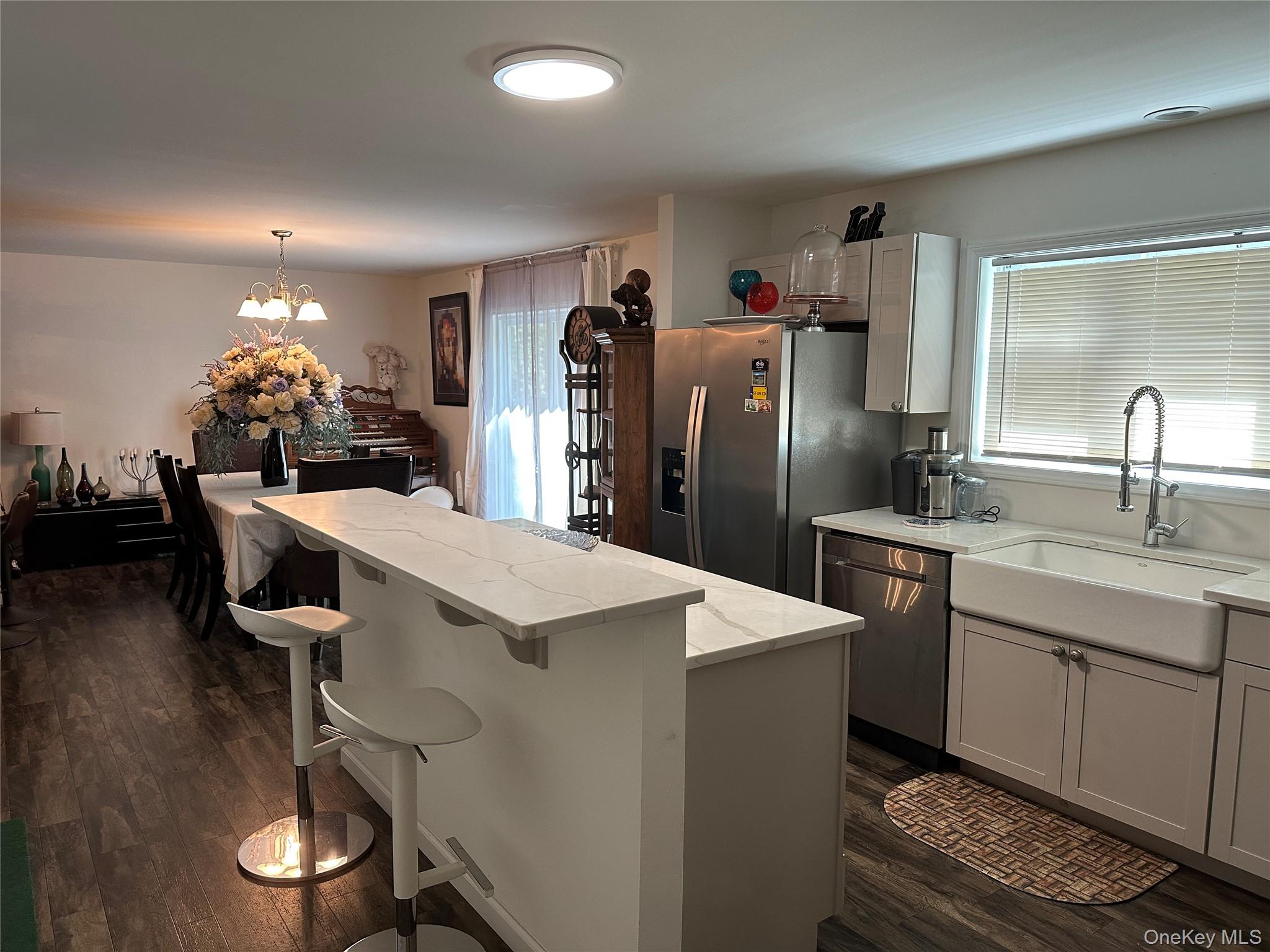 64 Schleiermacher Road Livingston Manor, NY 12758 - Photo 11 of 37 a kitchen with sink refrigerator and cabinets