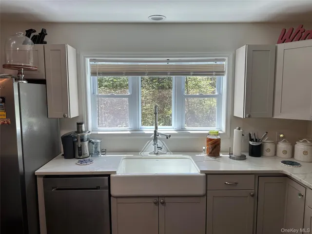 a kitchen with a sink and a window