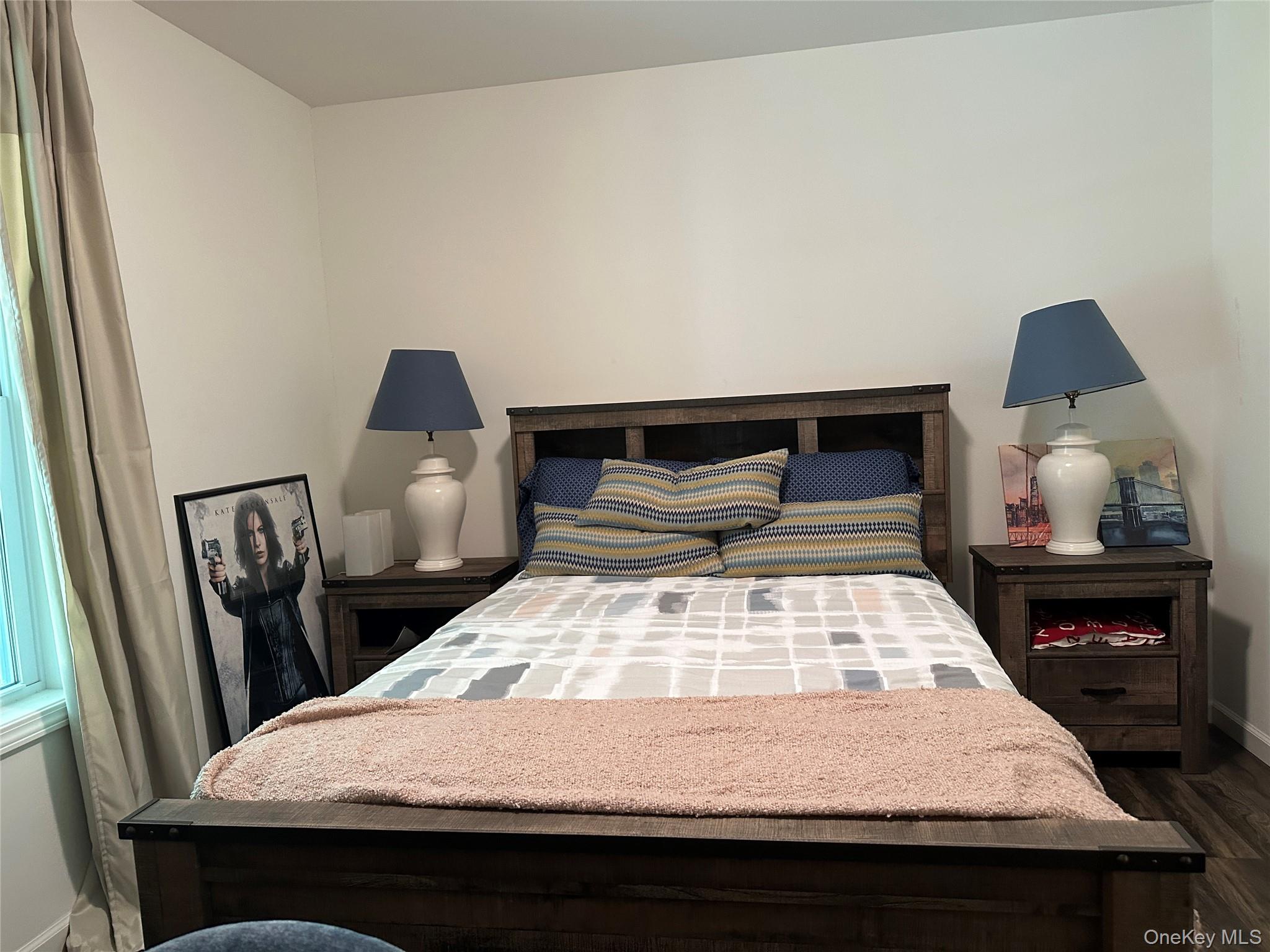 64 Schleiermacher Road Livingston Manor, NY 12758 - Photo 22 of 37 a bedroom with a bed and a lamp on dresser