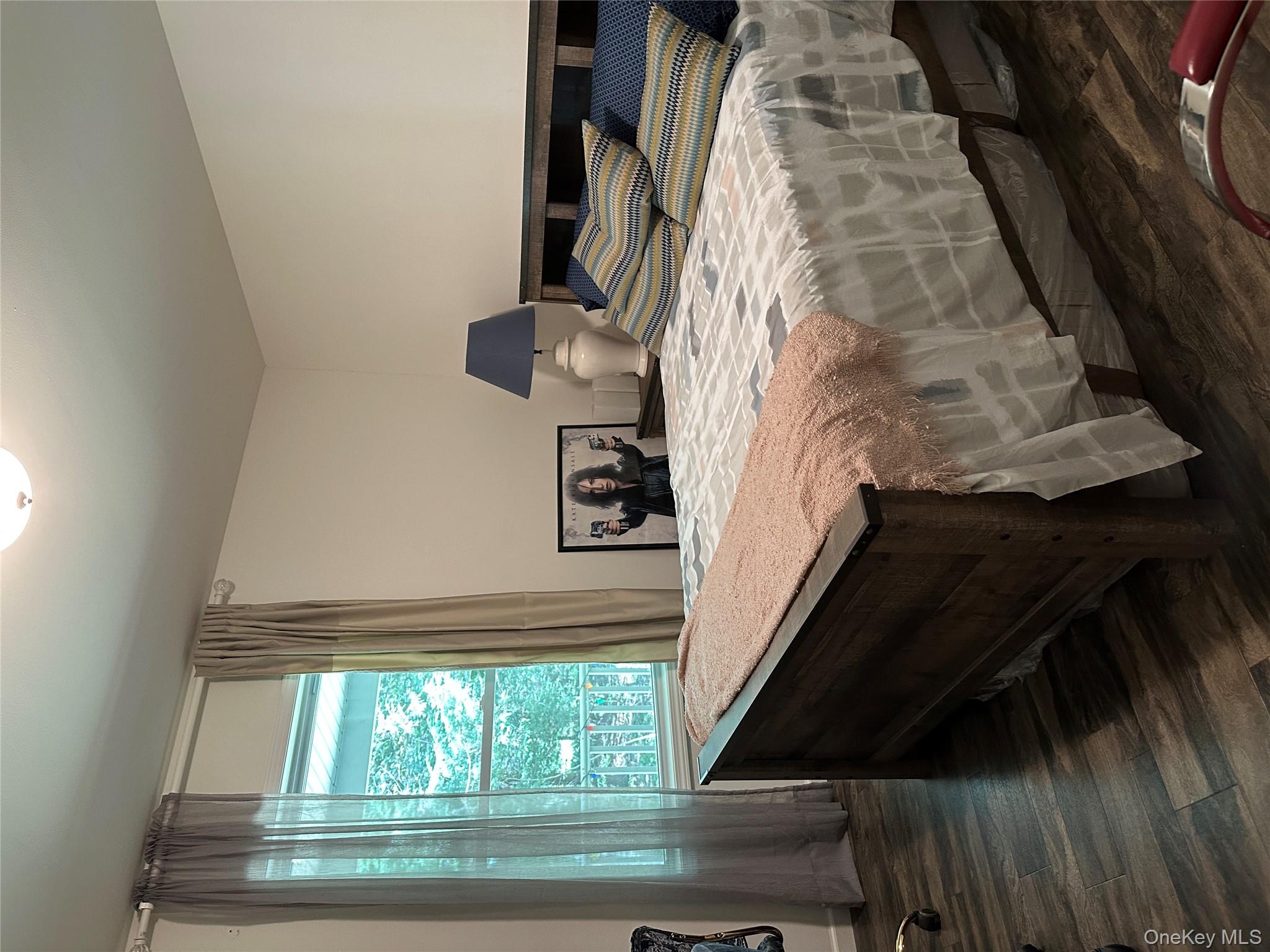 64 Schleiermacher Road Livingston Manor, NY 12758 - Photo 25 of 37 a bed sitting in a bedroom next to a window