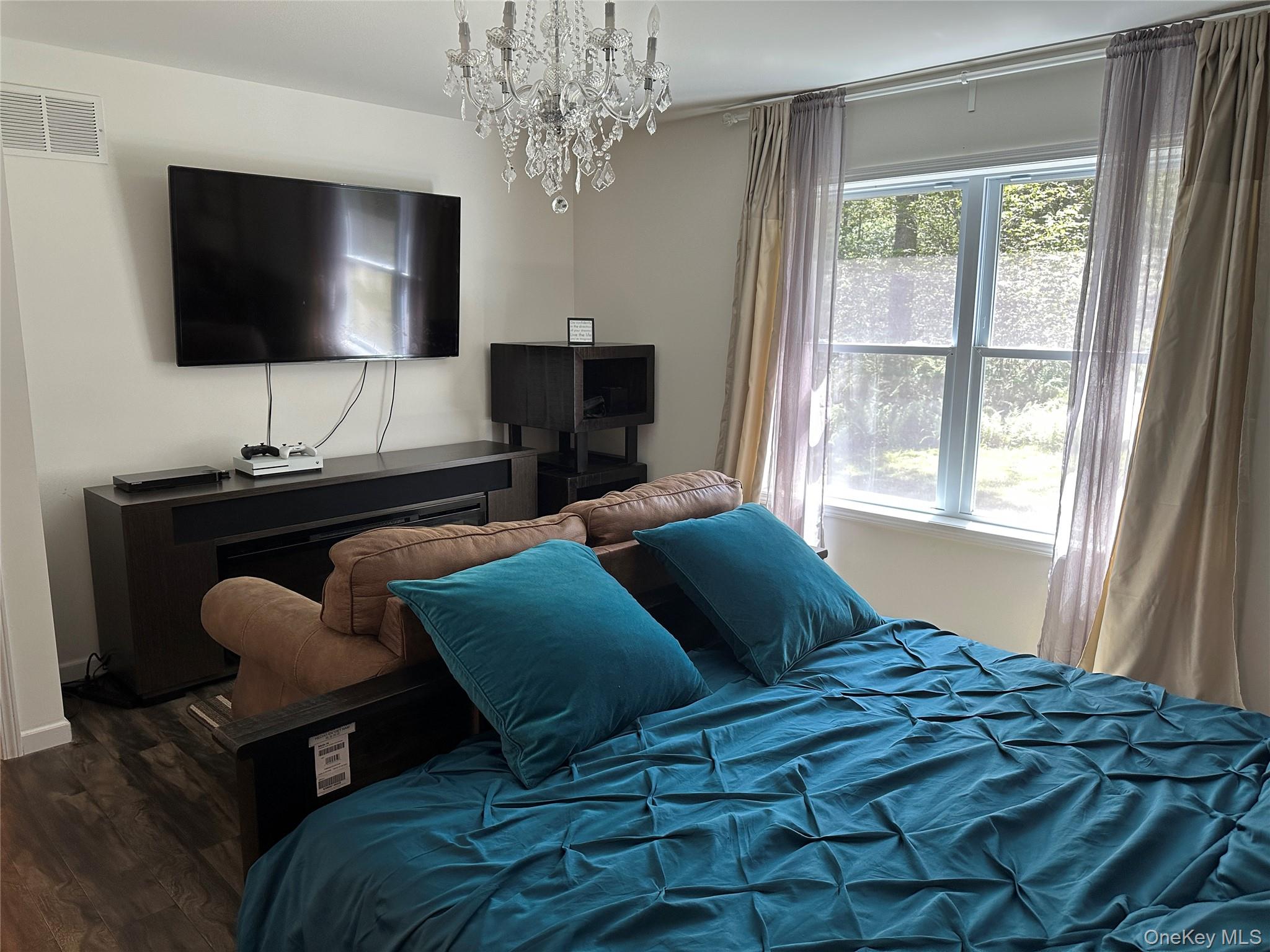 64 Schleiermacher Road Livingston Manor, NY 12758 - Photo 27 of 37 a bedroom with a bed and a flat screen tv