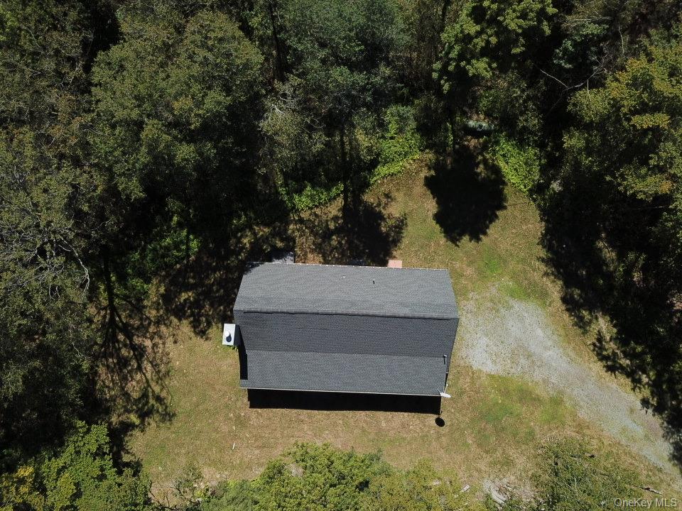 64 Schleiermacher Road Livingston Manor, NY 12758 - Photo 35 of 37 a wooden bench sitting in middle of a yard