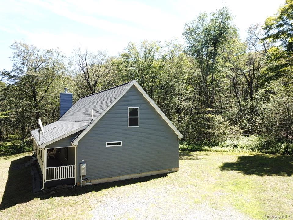 64 Schleiermacher Road Livingston Manor, NY 12758 - Photo 37 of 37 a front view of house with yard covered in snow