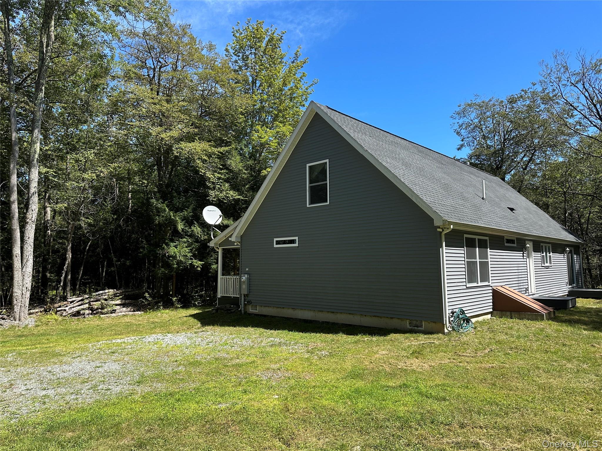 64 Schleiermacher Road Livingston Manor, NY 12758 - Photo 4 of 37 a view of a house with a yard