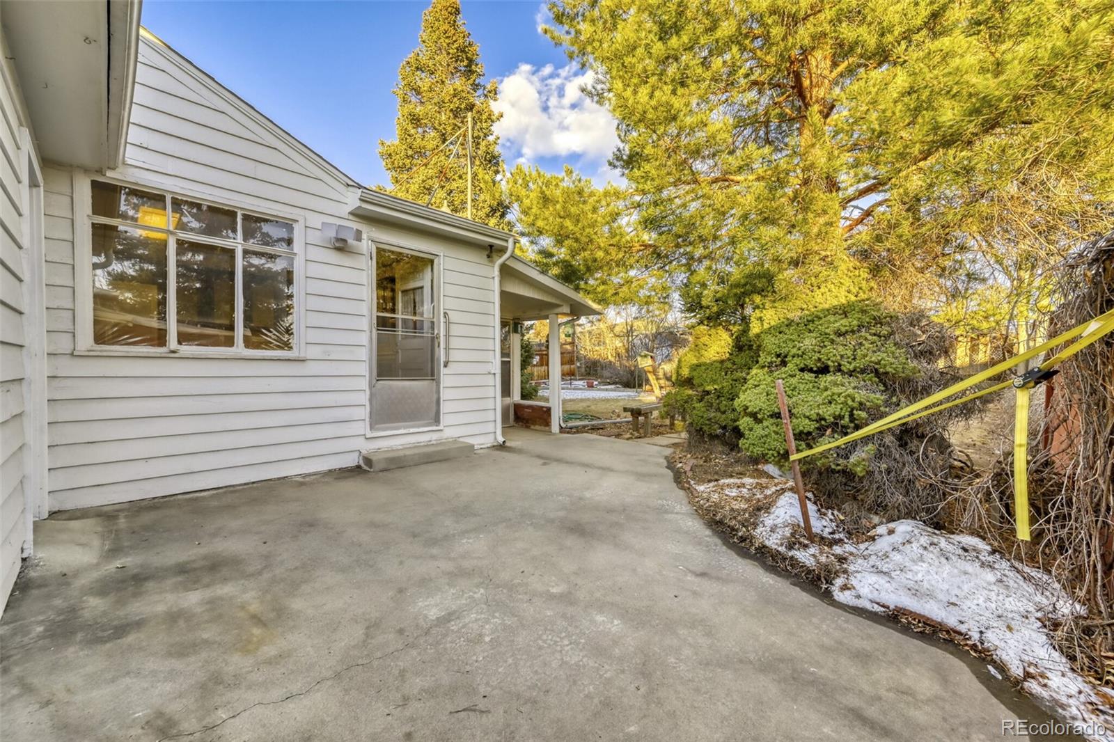 7850 Raleigh Street Westminster, CO 80030 - Photo 16 of 18 a view of a house with a tree