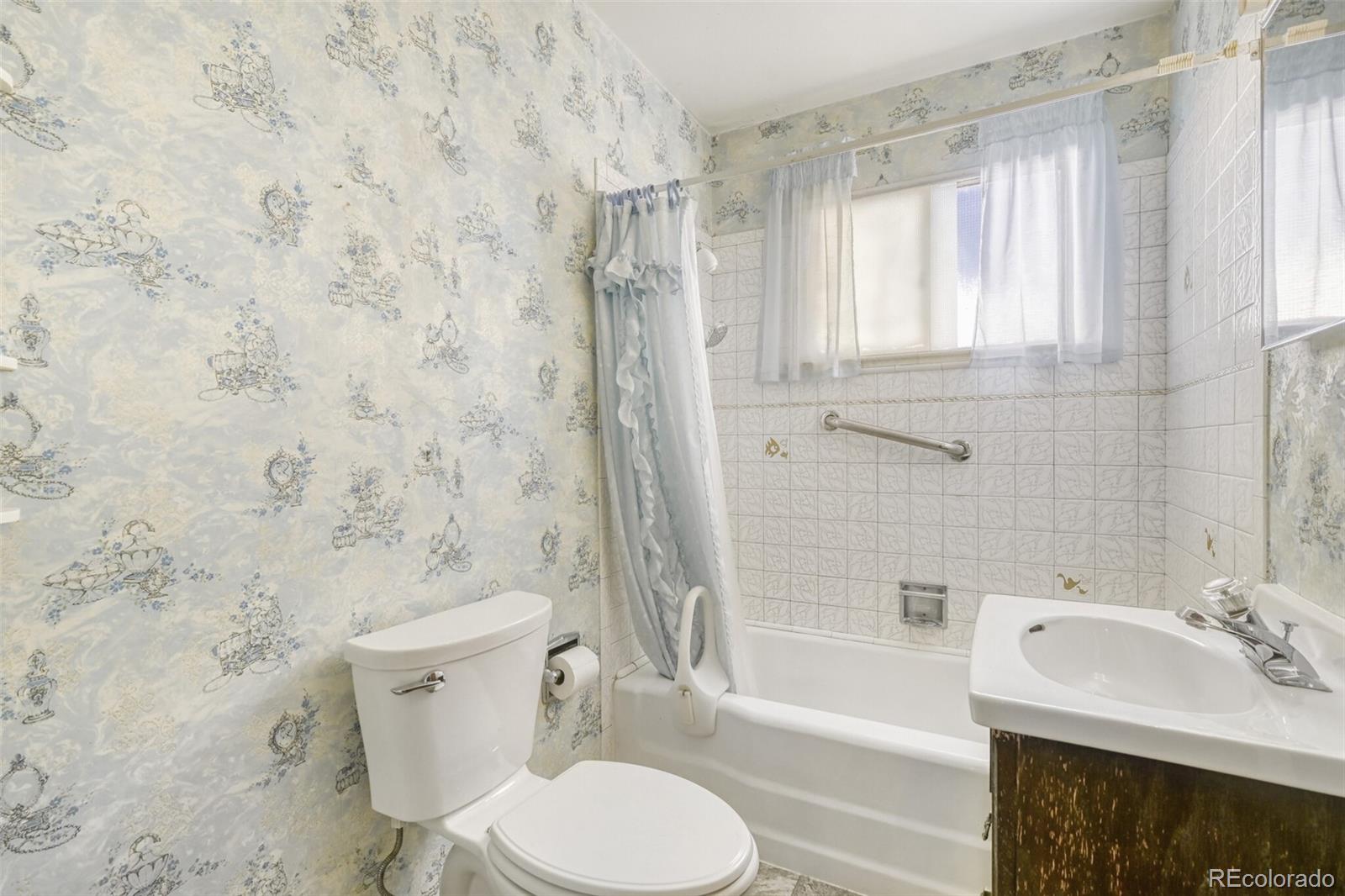 7850 Raleigh Street Westminster, CO 80030 - Photo 10 of 18 a bathroom with a sink toilet and shower