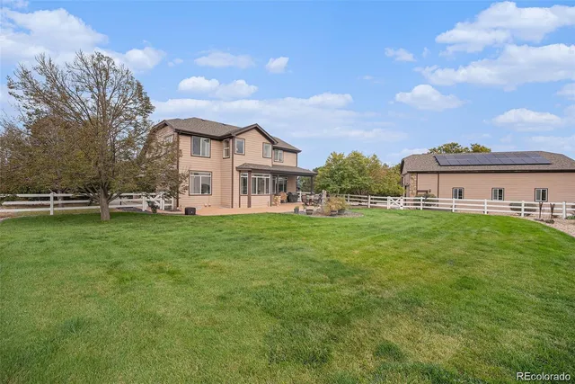 a view of a house with a big yard