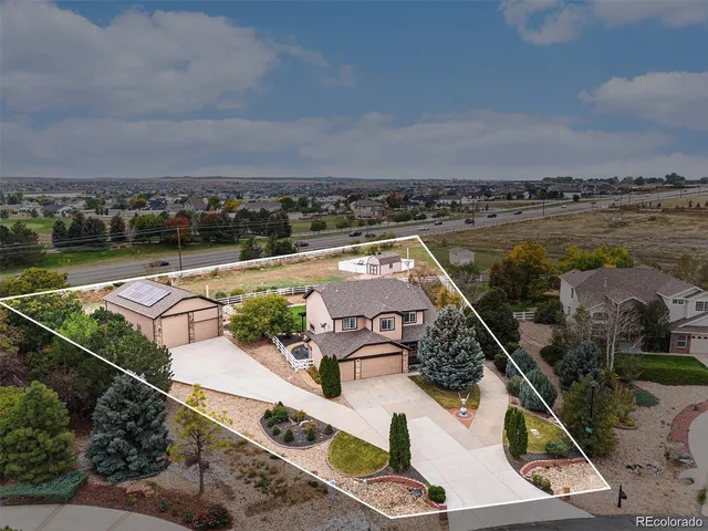 an aerial view of a house with a ocean view