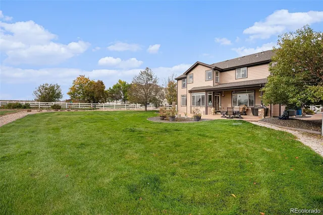 a view of a house with a big yard