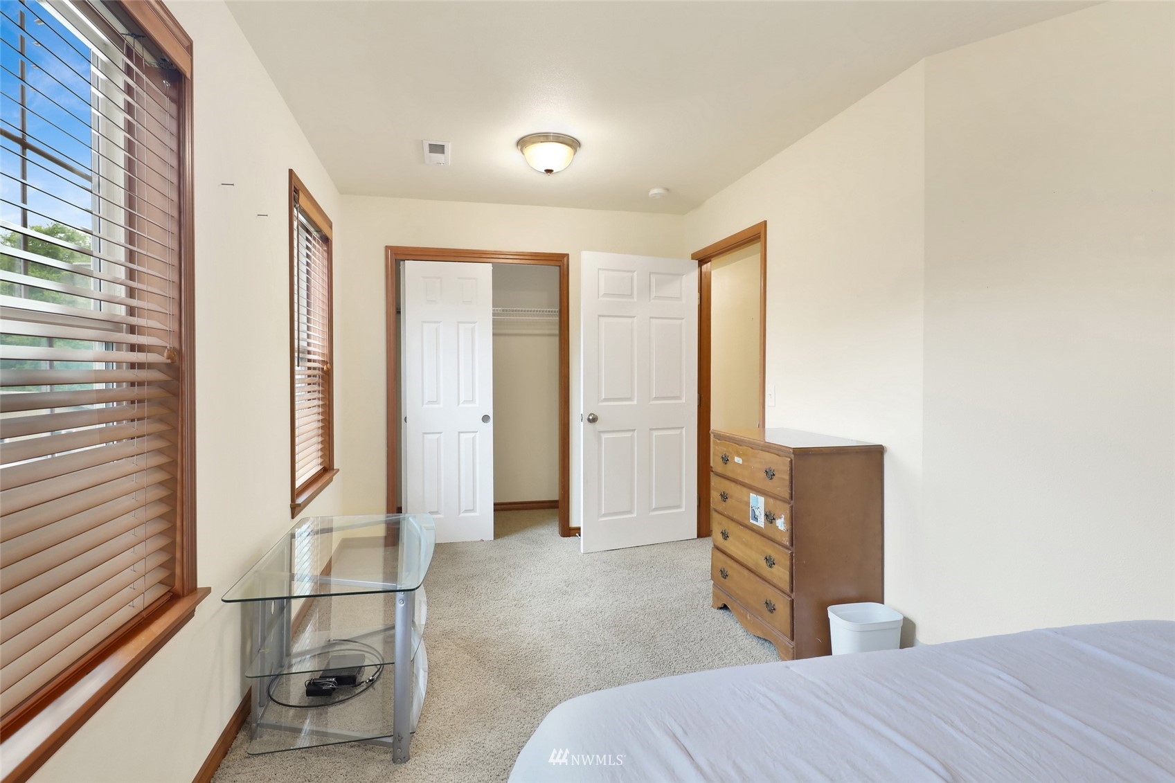 2708 Brown Road Ferndale, WA 98248 - Photo 35 of 38 a bedroom with a bed and wooden floor