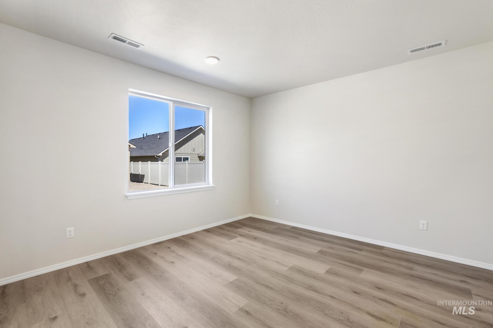 1542 Kenyon Road Twin Falls, ID 83301 - Photo 17 of 26 Unfurnished room with light wood-style flooring