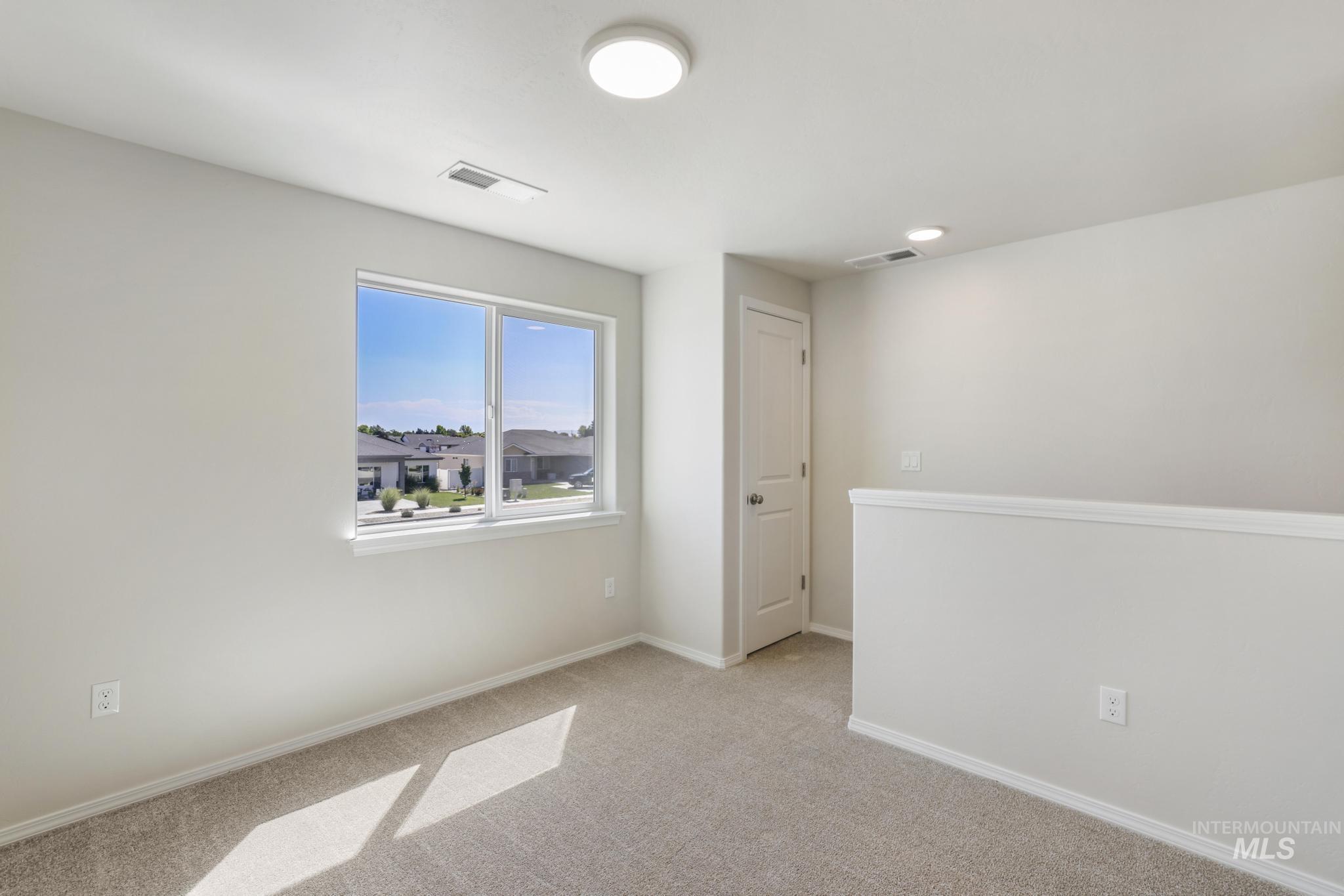 1542 Kenyon Road Twin Falls, ID 83301 - Photo 19 of 26 Empty room with carpet and baseboards