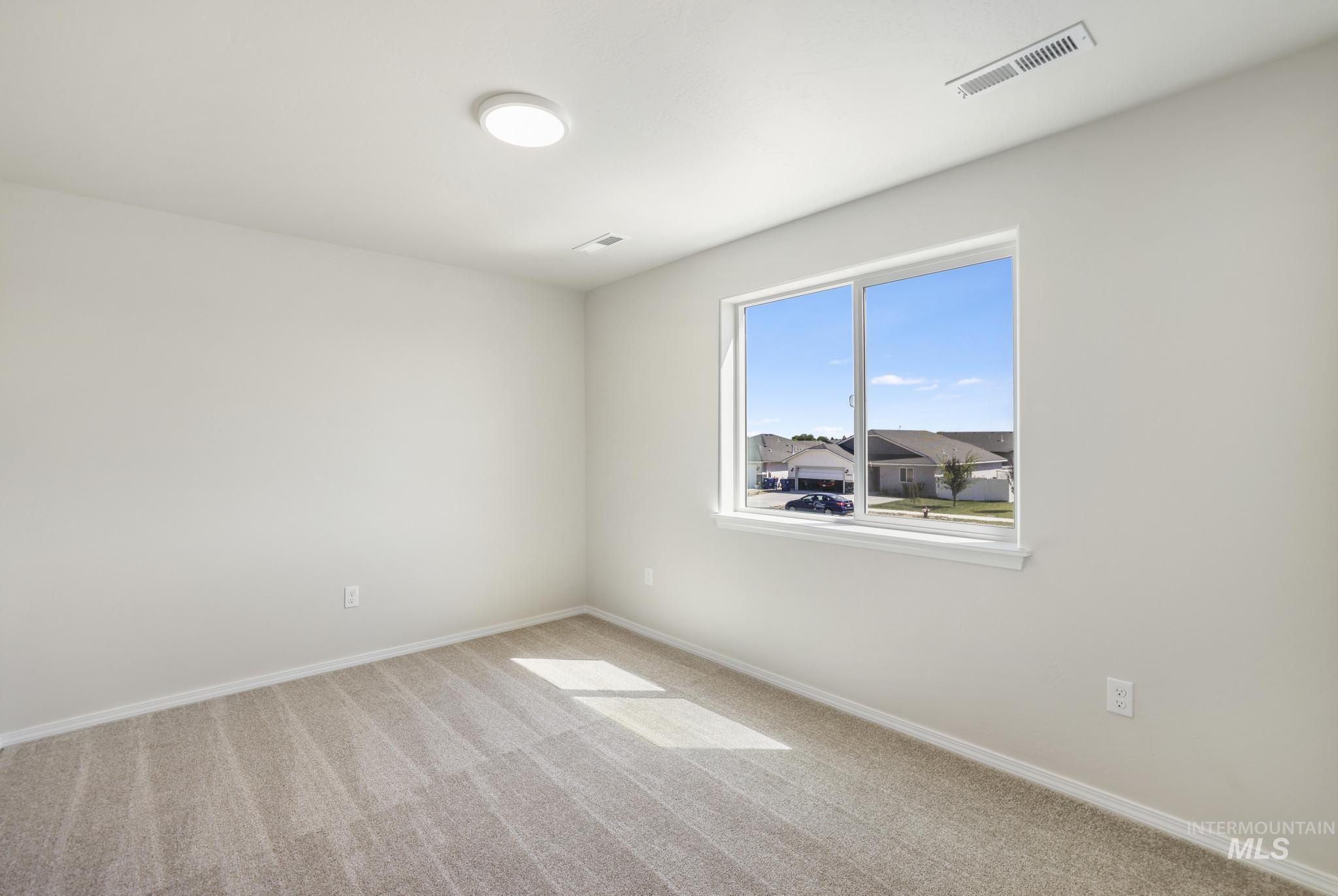 1542 Kenyon Road Twin Falls, ID 83301 - Photo 20 of 26 Unfurnished room featuring carpet and baseboards