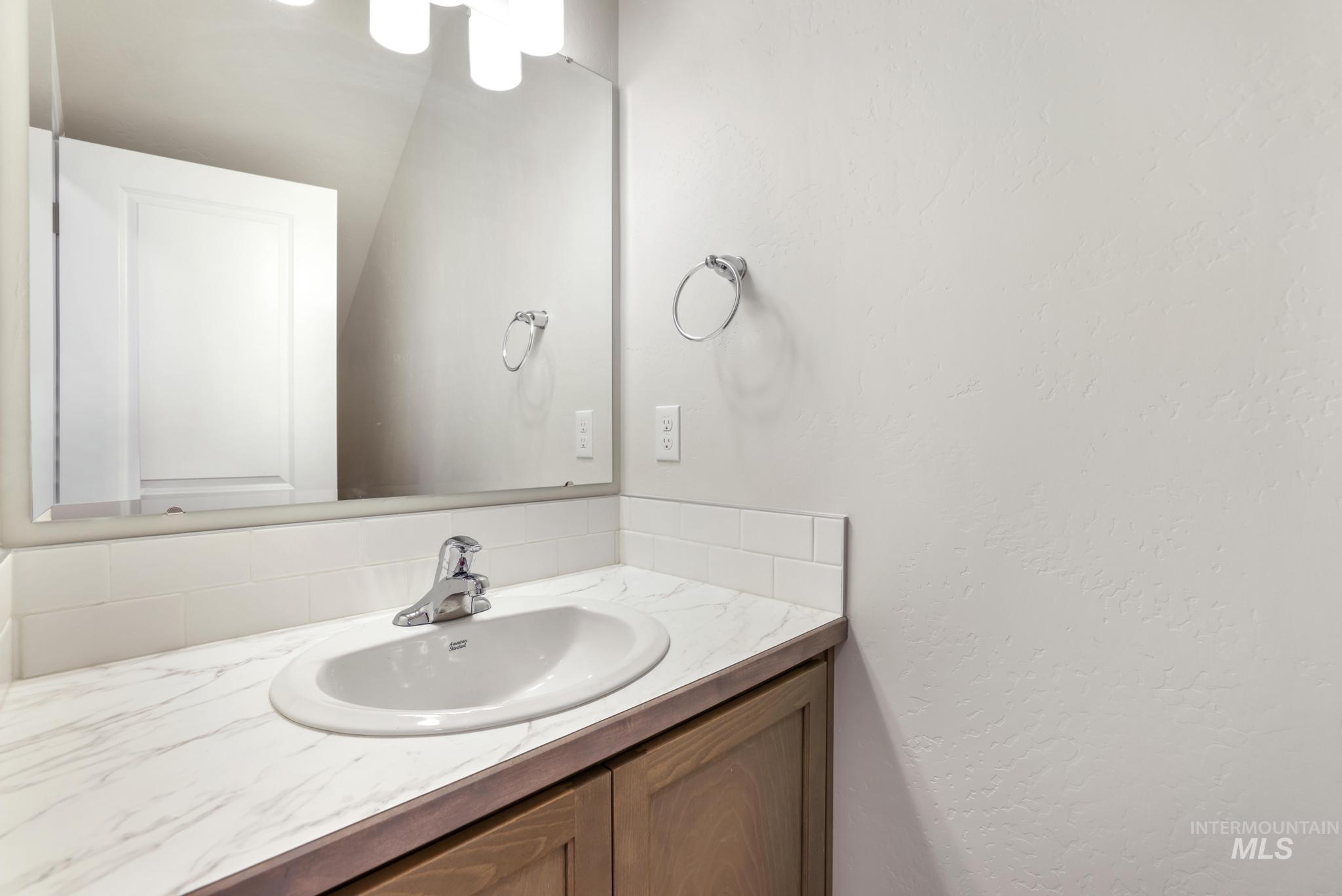 1542 Kenyon Road Twin Falls, ID 83301 - Photo 3 of 26 Bathroom featuring vanity and a textured wall