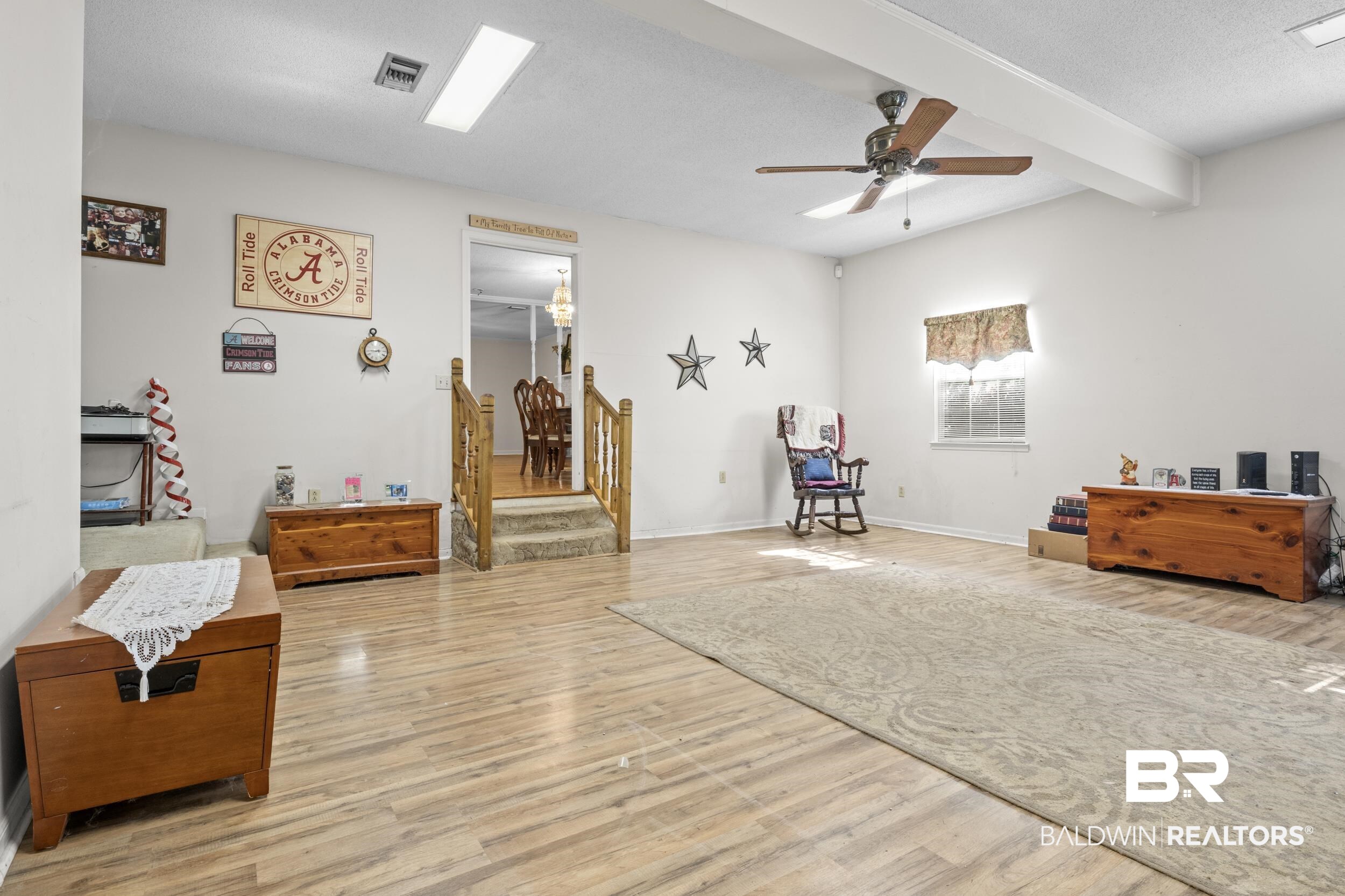 8701 A Rosemary Road Eight Mile, AL 36613 - Photo 7 of 27 Sitting room with ceiling fan, light hardwood / wood-style flooring, and beamed ceiling