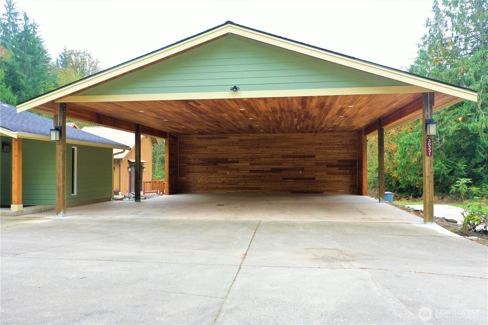 30331 Heimer Road Arlington, WA 98223 - Photo 10 of 37 a small yard with a table and chair under an umbrella