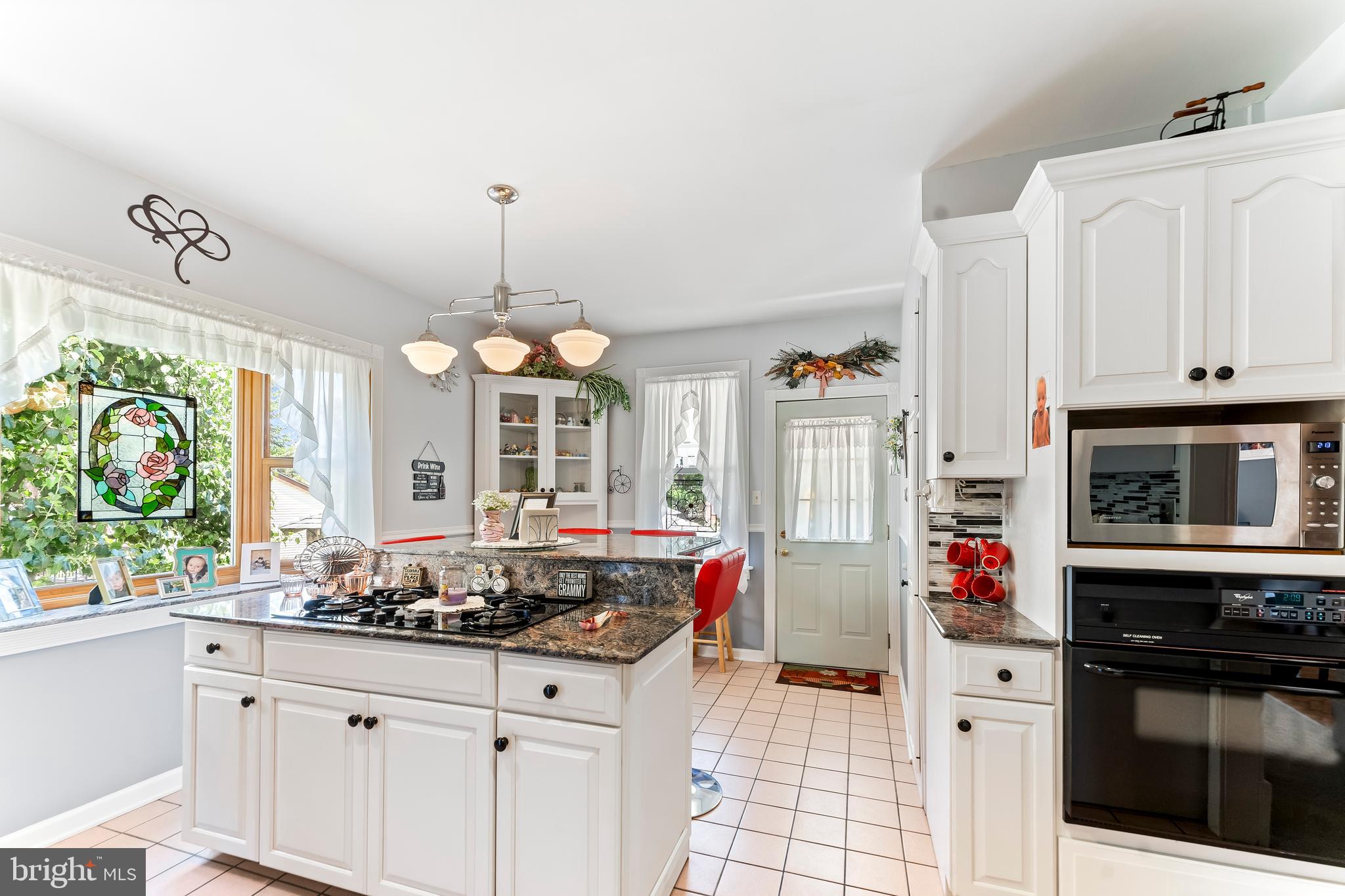 307 Lenox Road Havertown, PA 19083 - Photo 8 of 27 a kitchen with stainless steel appliances granite countertop a stove and a white cabinets