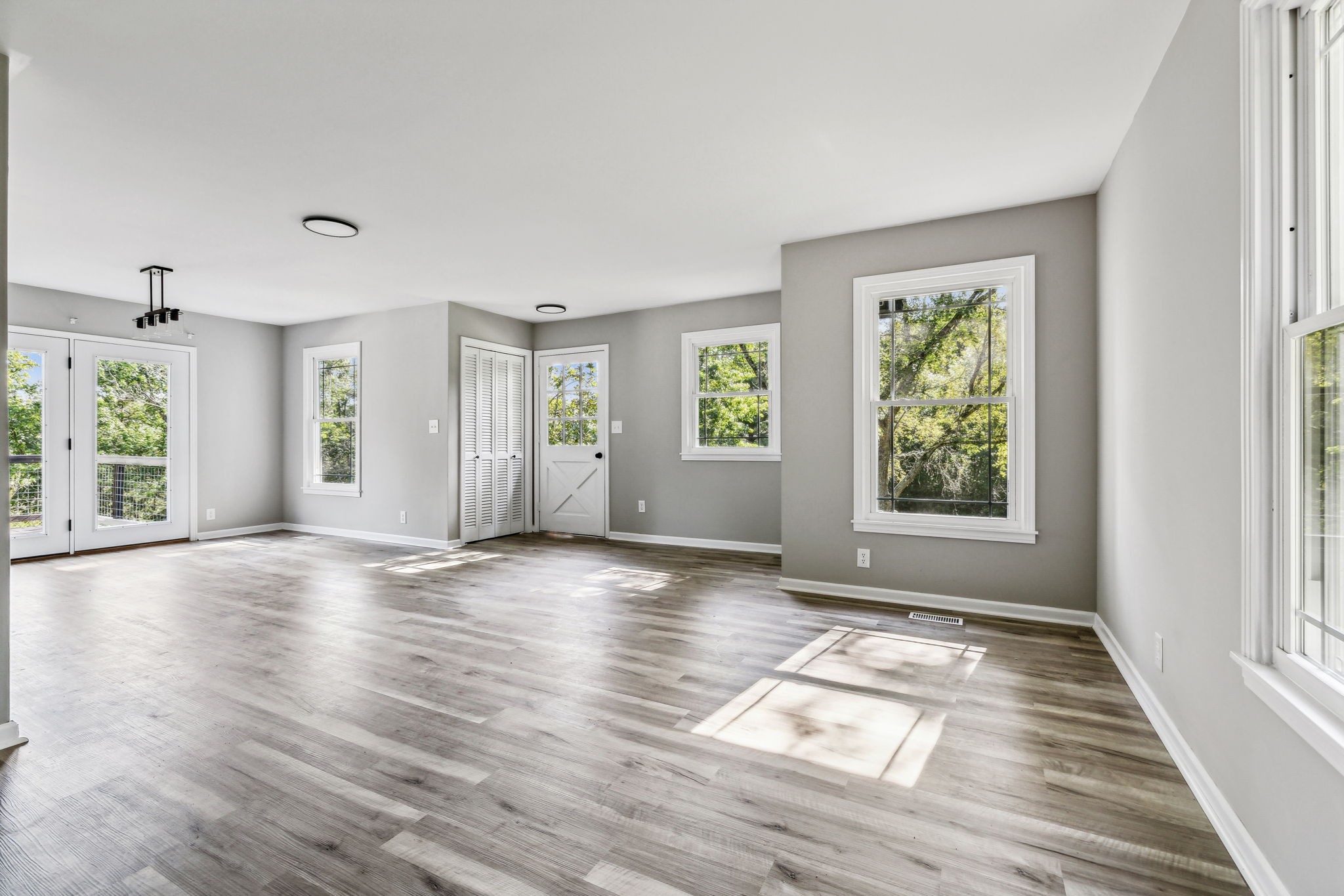 87 Gladdice Road Pleasant Shade, TN 37145 - Photo 13 of 47 an empty room with wooden floor and windows