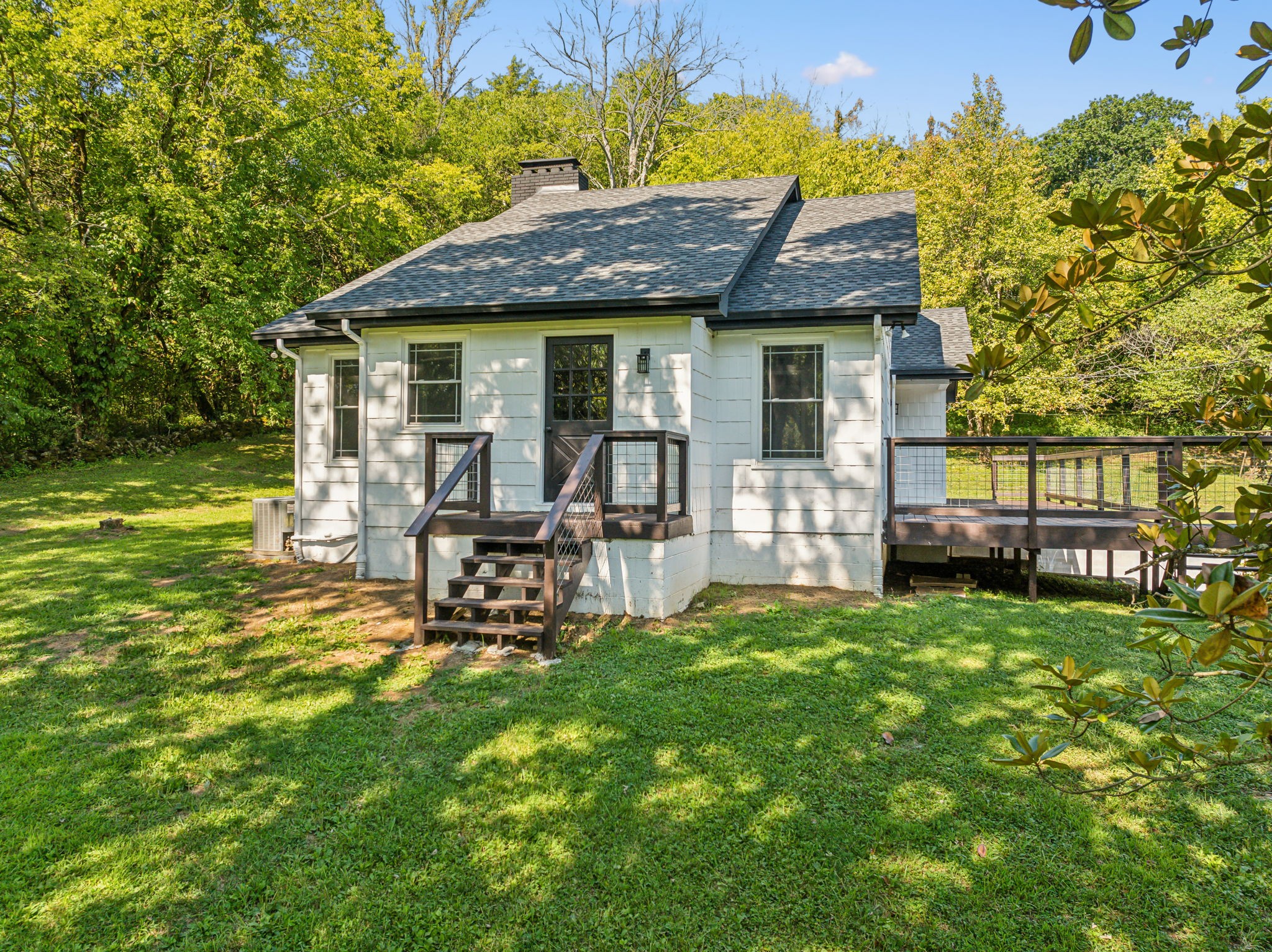 87 Gladdice Road Pleasant Shade, TN 37145 - Photo 3 of 47 a view of a house with a yard porch and sitting area