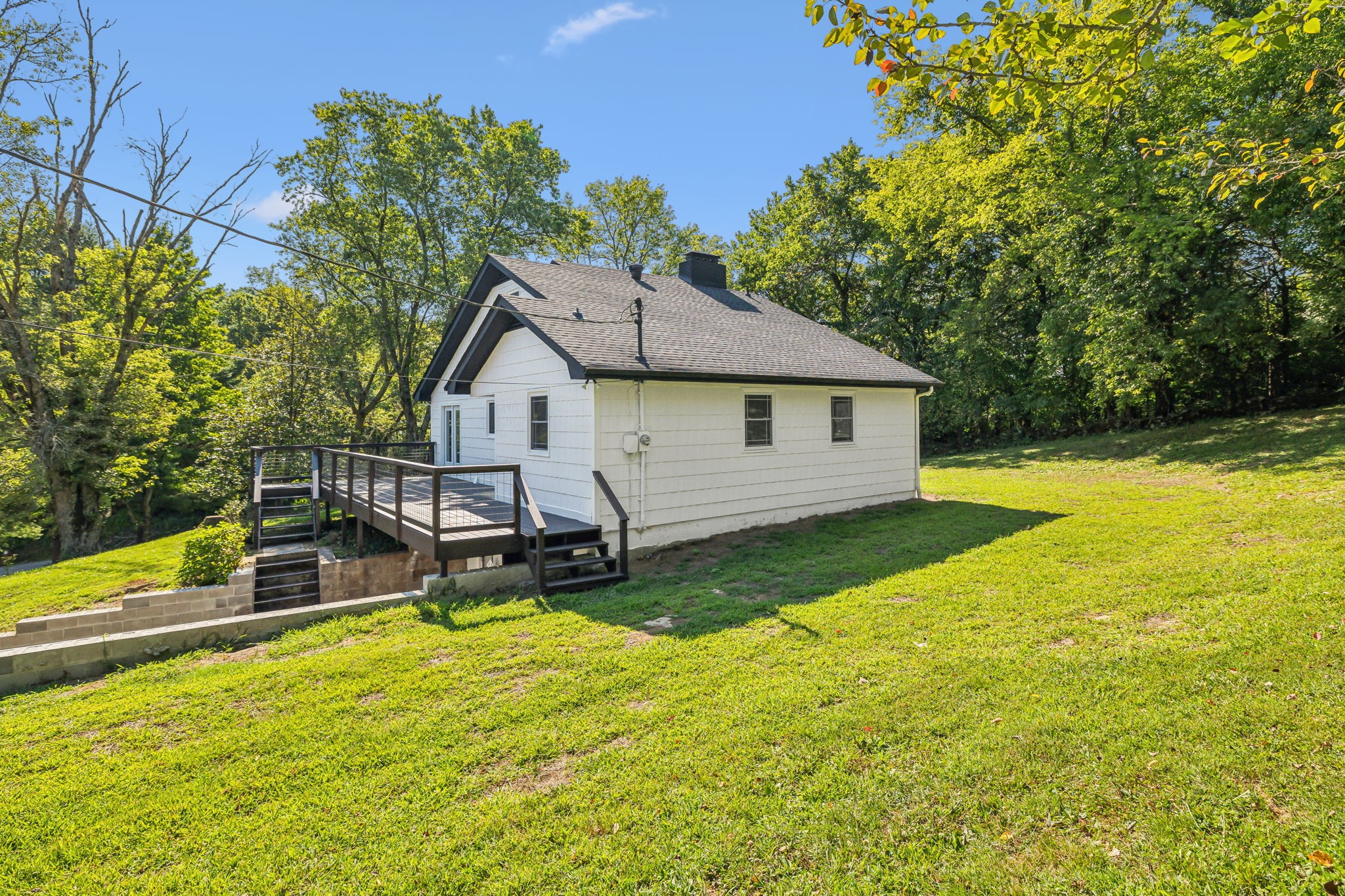 87 Gladdice Road Pleasant Shade, TN 37145 - Photo 44 of 47 a view of a house with backyard and sitting area