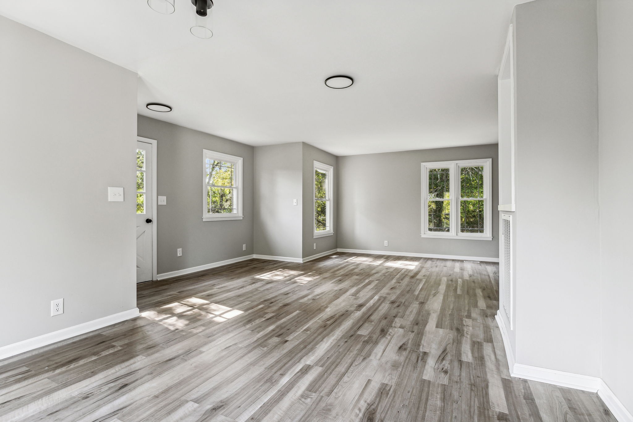 87 Gladdice Road Pleasant Shade, TN 37145 - Photo 8 of 47 an empty room with window and wooden floor