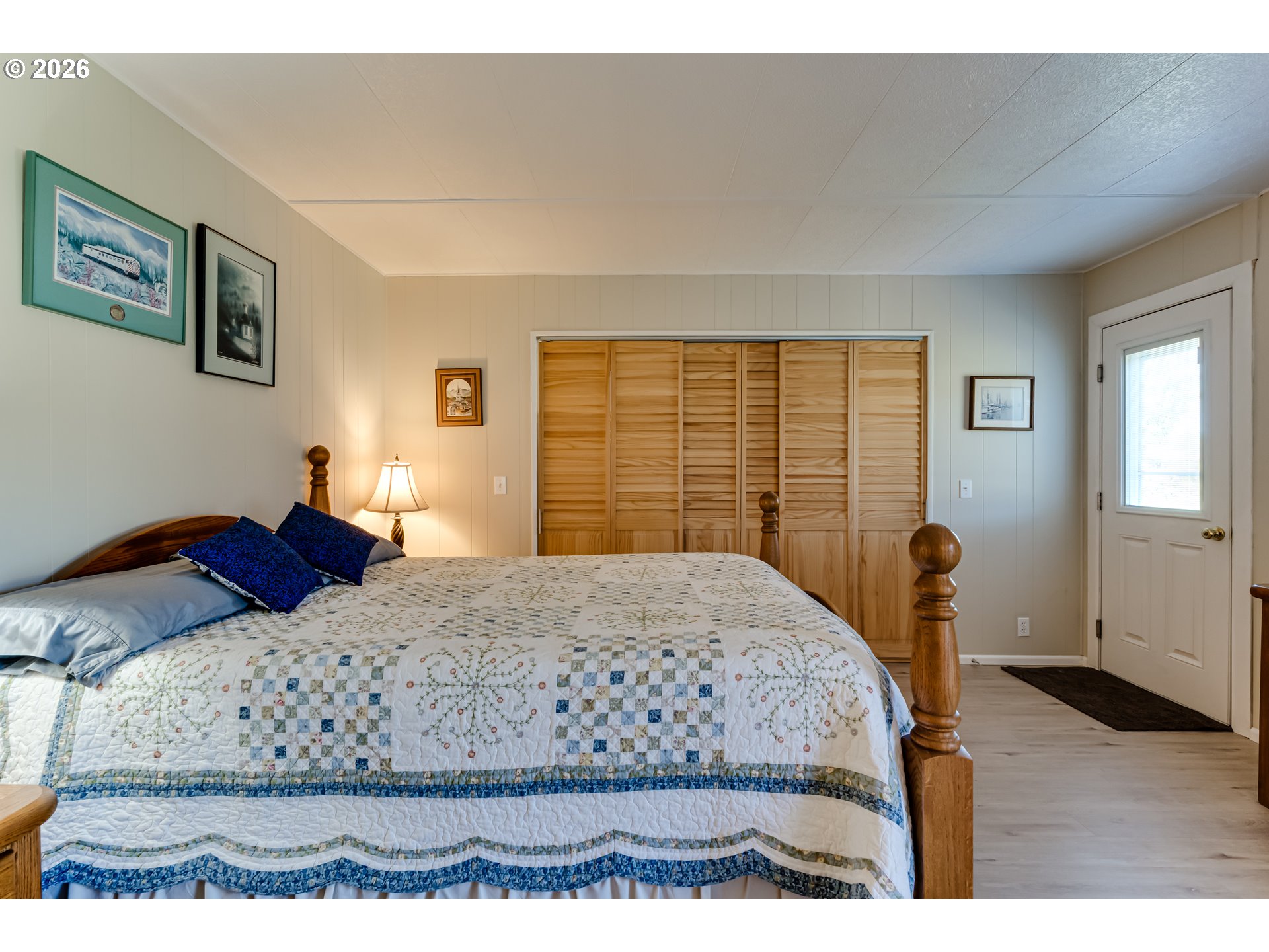 34681 Devonshire Drive Eugene, OR 97405 - Photo 19 of 34 a bedroom with a large bed and wooden floor