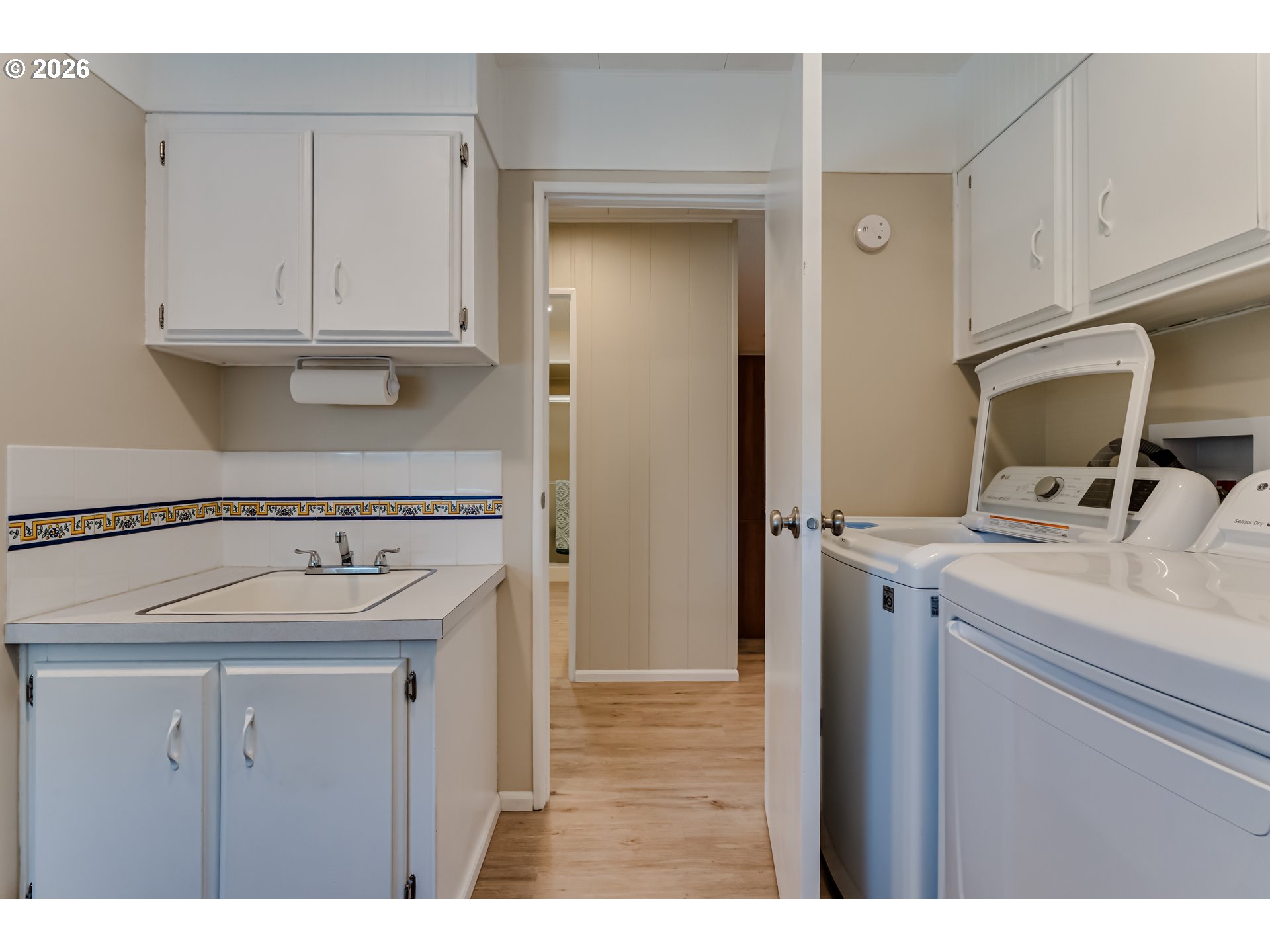 34681 Devonshire Drive Eugene, OR 97405 - Photo 24 of 34 a utility room with cabinets washer and dryer