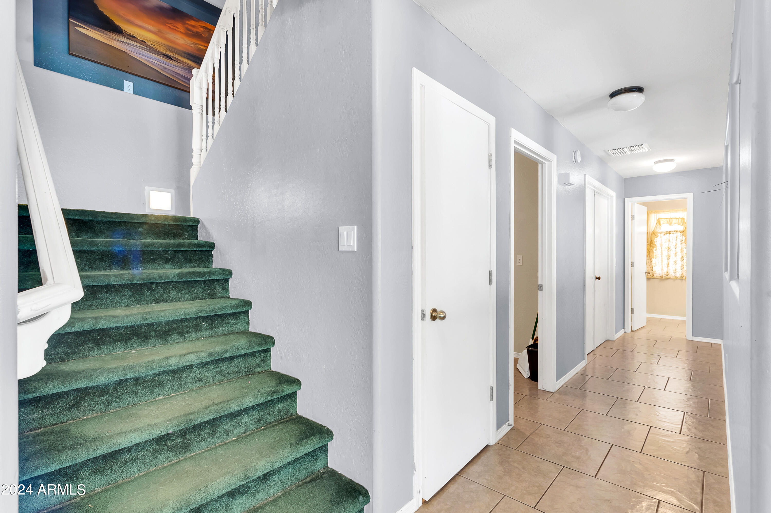 1215 West Ocotillo Street Coolidge, AZ 85128 - Photo 12 of 29 a view of a hallway with stairs
