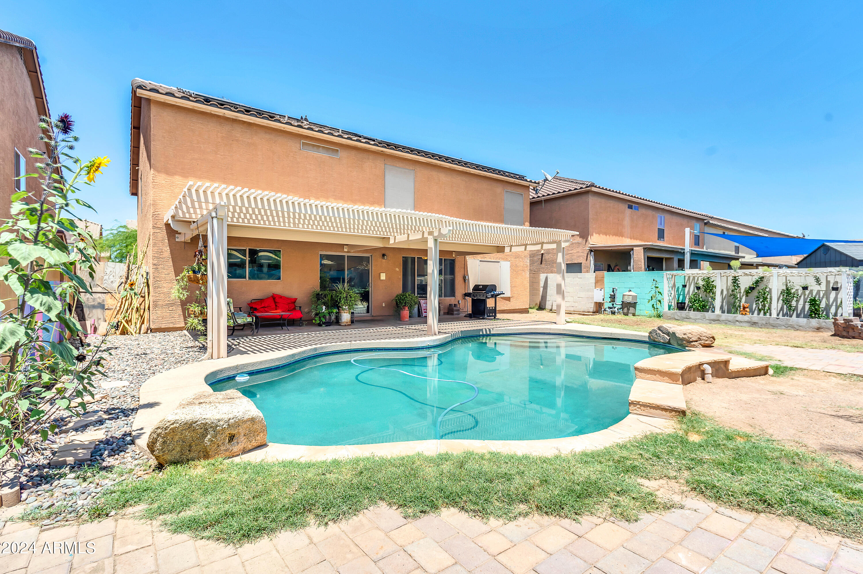 1215 West Ocotillo Street Coolidge, AZ 85128 - Photo 2 of 29 a view of a house with a swimming pool