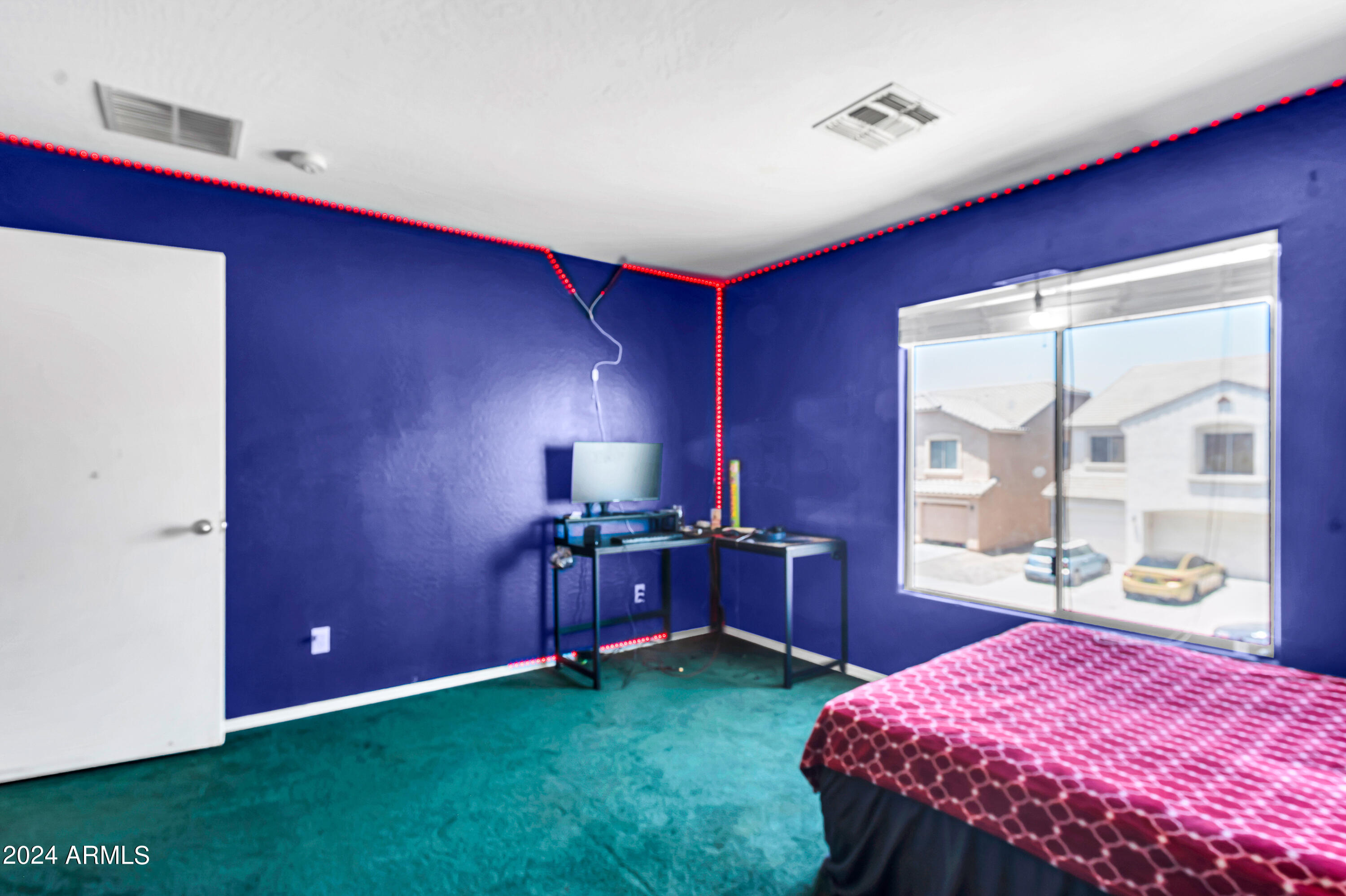 1215 West Ocotillo Street Coolidge, AZ 85128 - Photo 23 of 29 a bedroom with a bed and a dresser