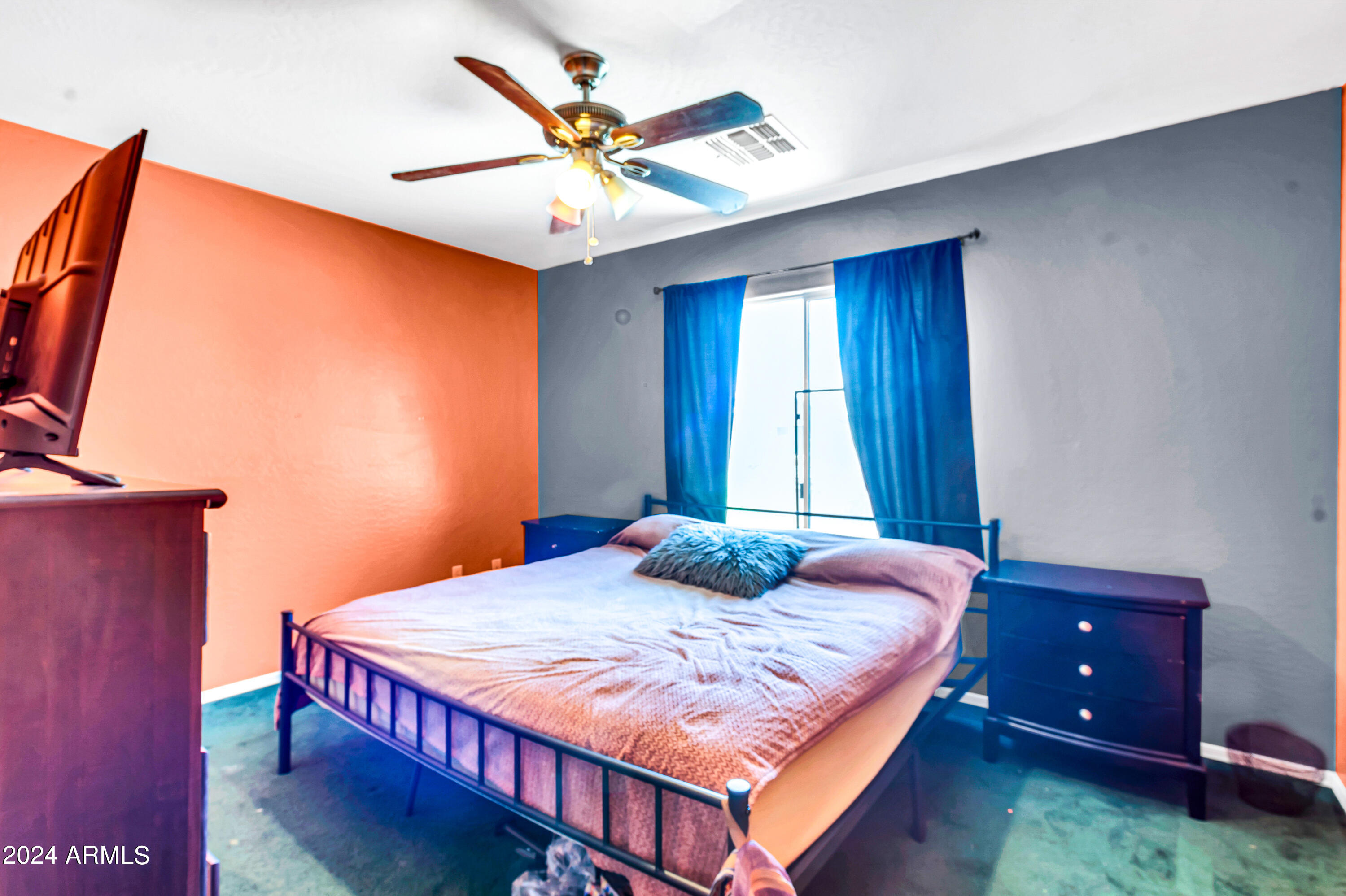 1215 West Ocotillo Street Coolidge, AZ 85128 - Photo 25 of 29 a bedroom with a bed and a chandelier