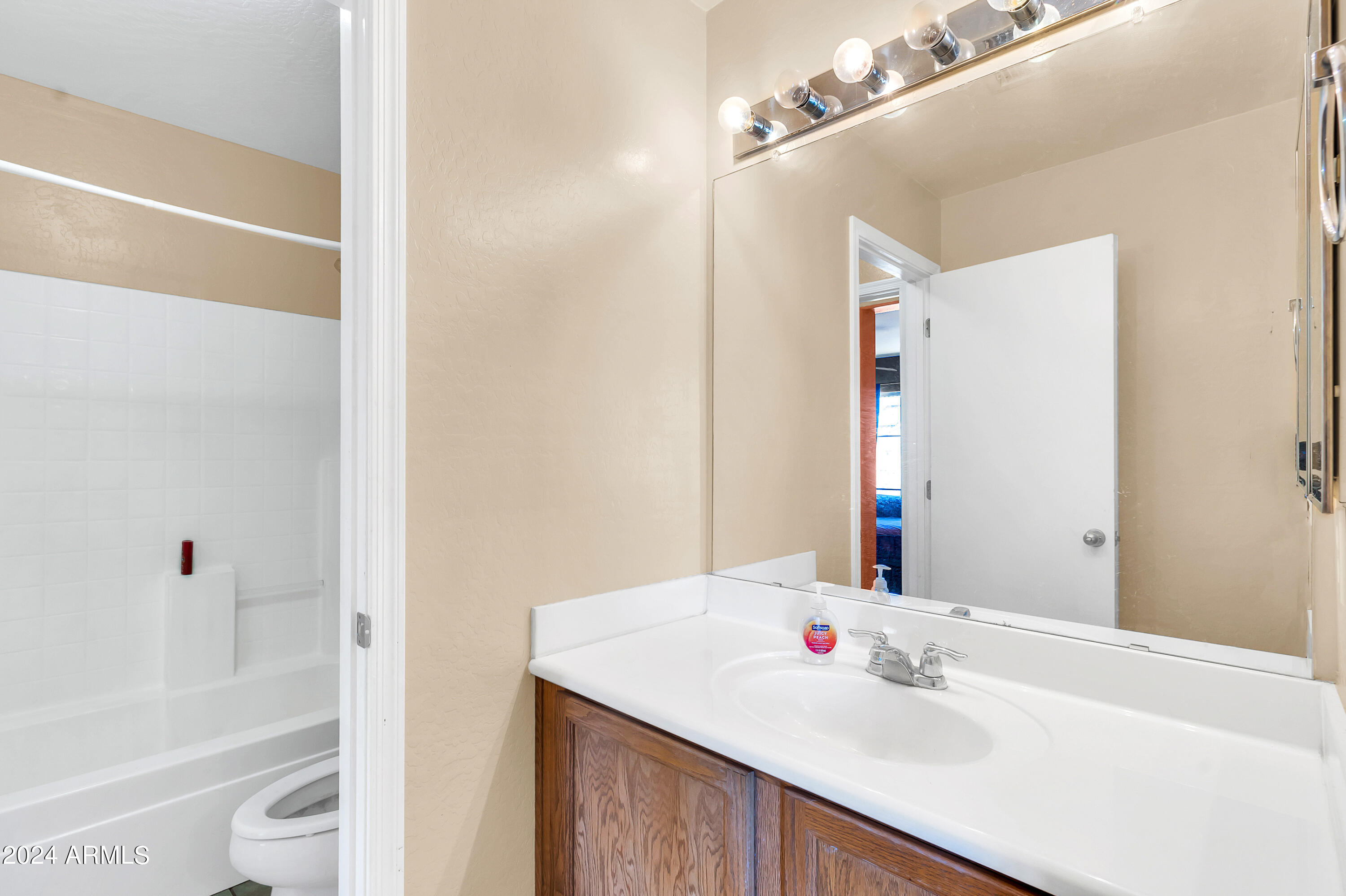 1215 West Ocotillo Street Coolidge, AZ 85128 - Photo 26 of 29 a bathroom with a sink and a mirror