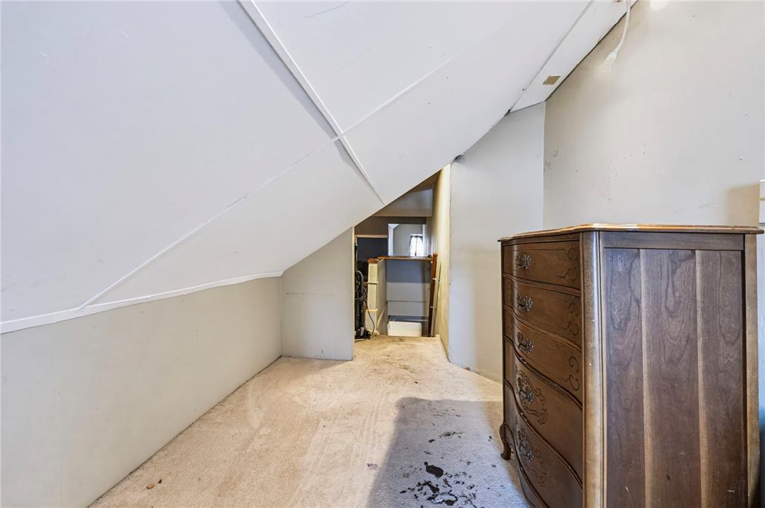 1030 Monocacy Street Bethlehem, PA 18018 - Photo 28 of 34 Angled ceilings and carpeted flooring define this cozy upper-level bonus space.