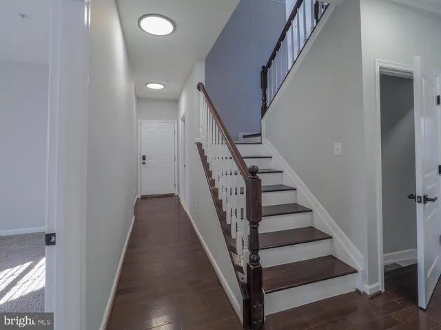 a bathroom with a sink mirror vanity and toilet