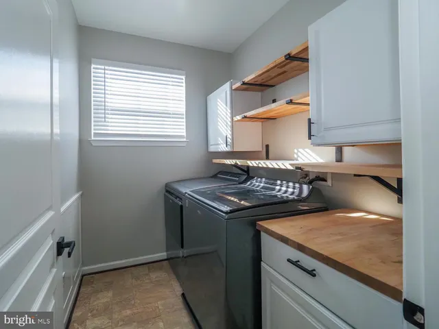 a view of a livingroom with an empty space and a fireplace