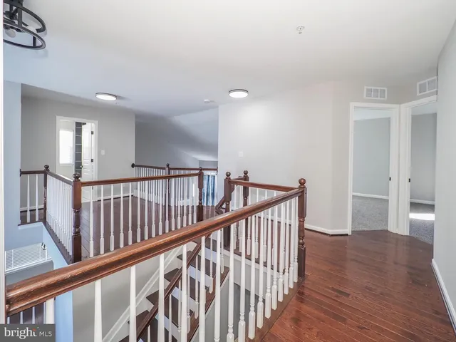 a view of a livingroom with a ceiling fan and window