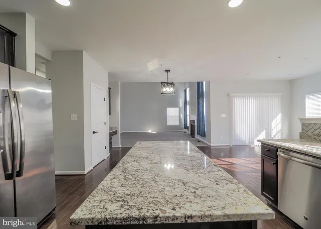 a view of hallway with wooden floor