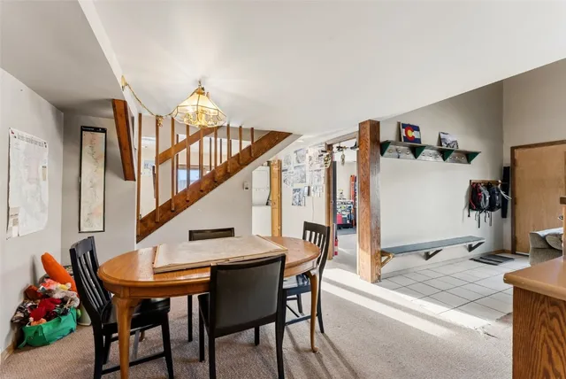 a dining room with furniture and entryway