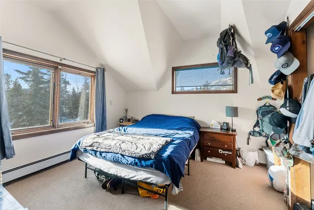 a bedroom with a bed and a lamp