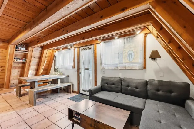 a bedroom with bed and a window