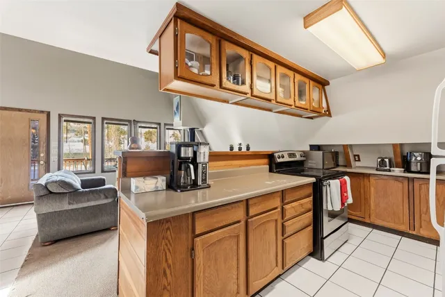 a kitchen with stainless steel appliances granite countertop a sink and cabinets