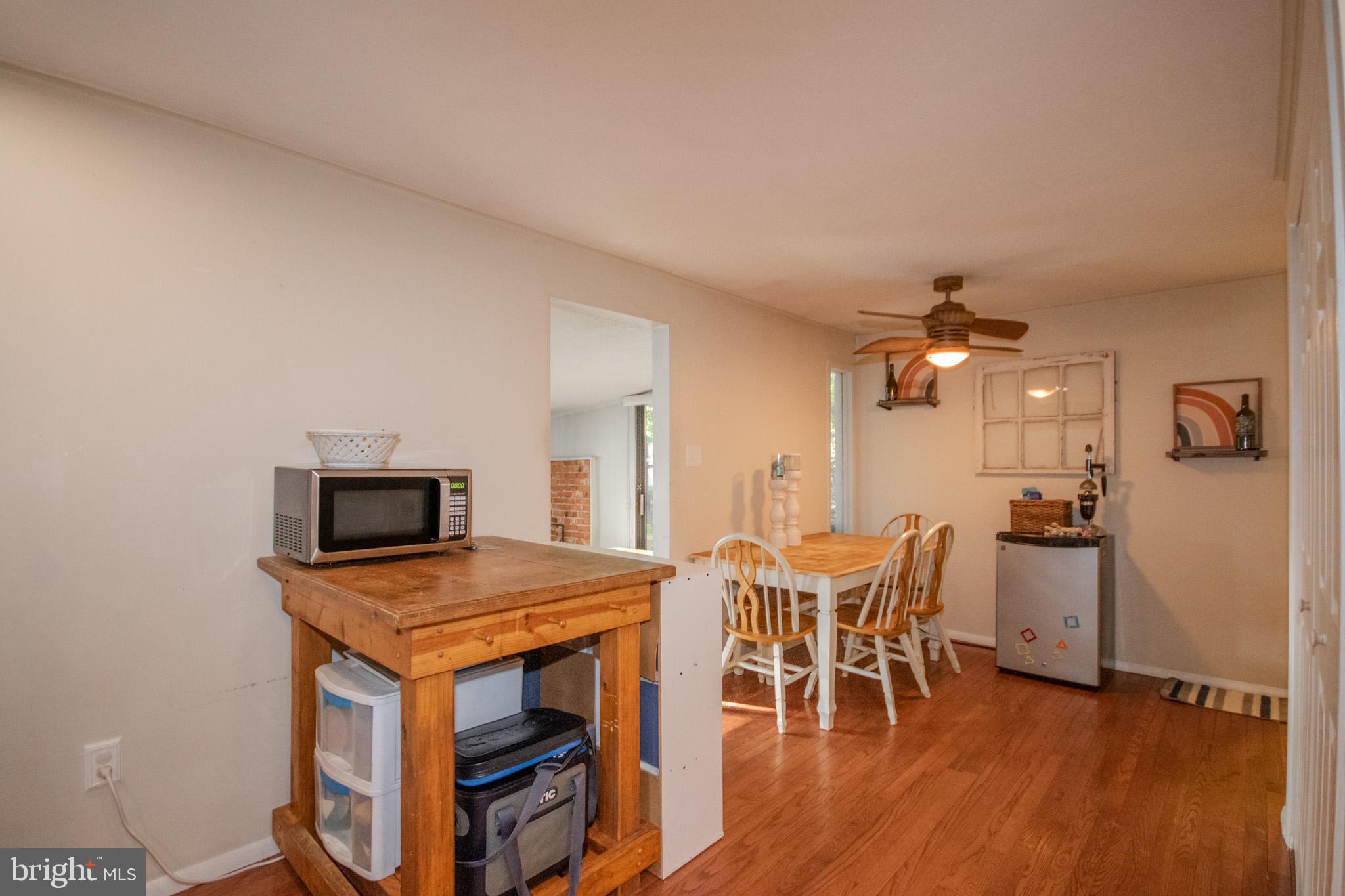 60 Beaconhill Road Ocean Pines, MD 21811 - Photo 11 of 30 a view of a dining room with furniture and wooden floor