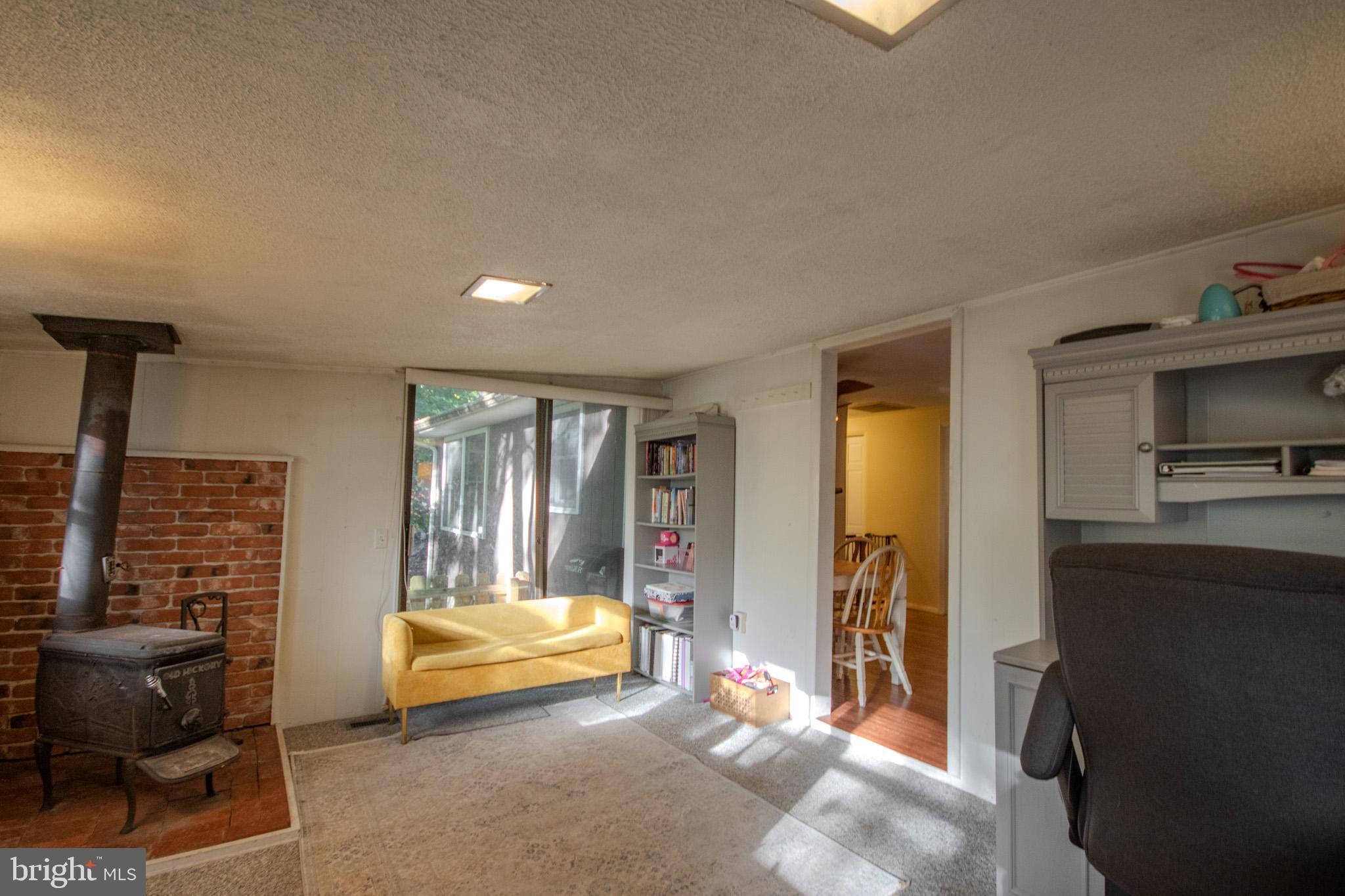 60 Beaconhill Road Ocean Pines, MD 21811 - Photo 13 of 30 a spacious bedroom with a bed and large windows