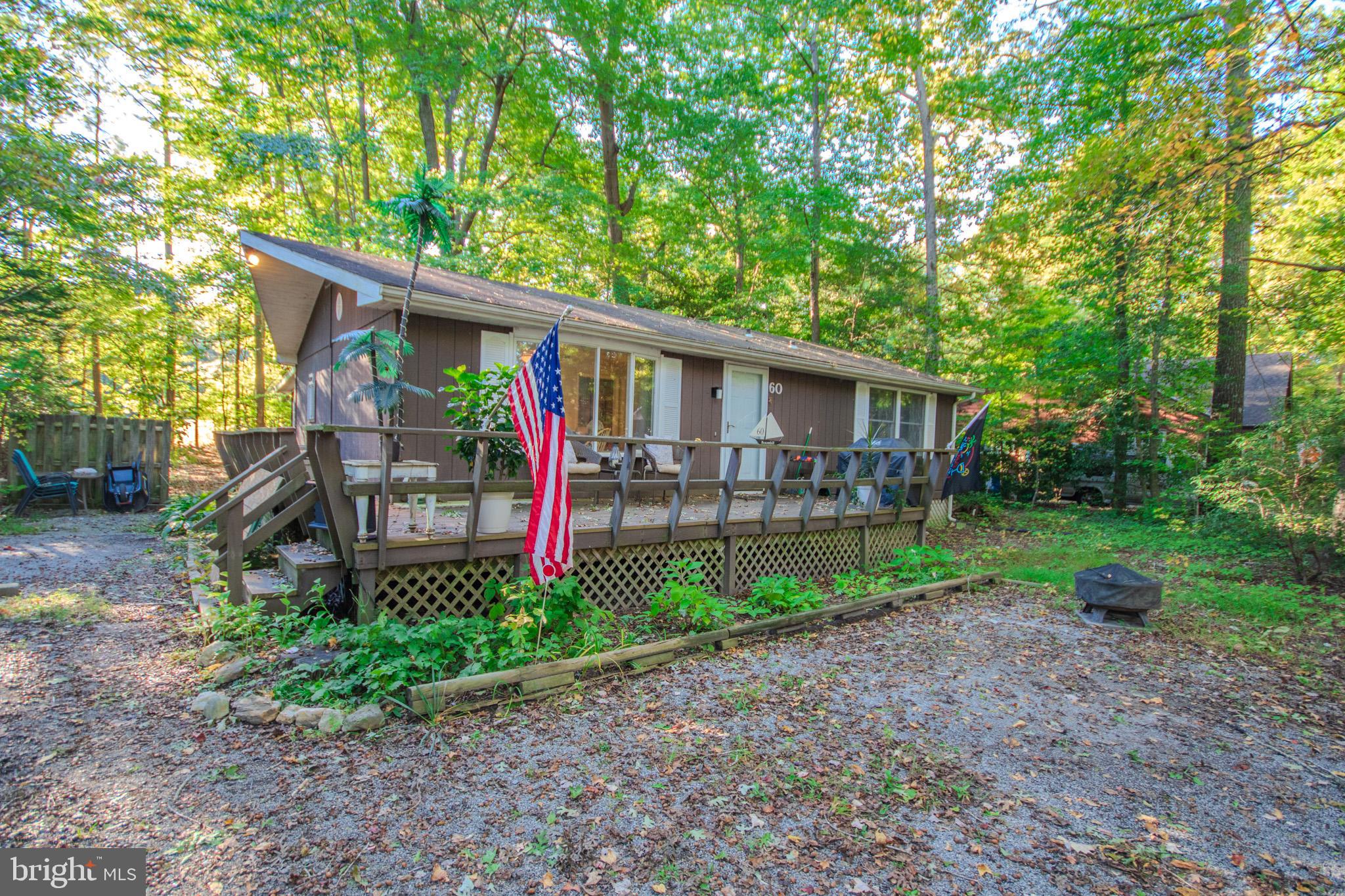 60 Beaconhill Road Ocean Pines, MD 21811 - Photo 2 of 30 a front view of house with yard and green space